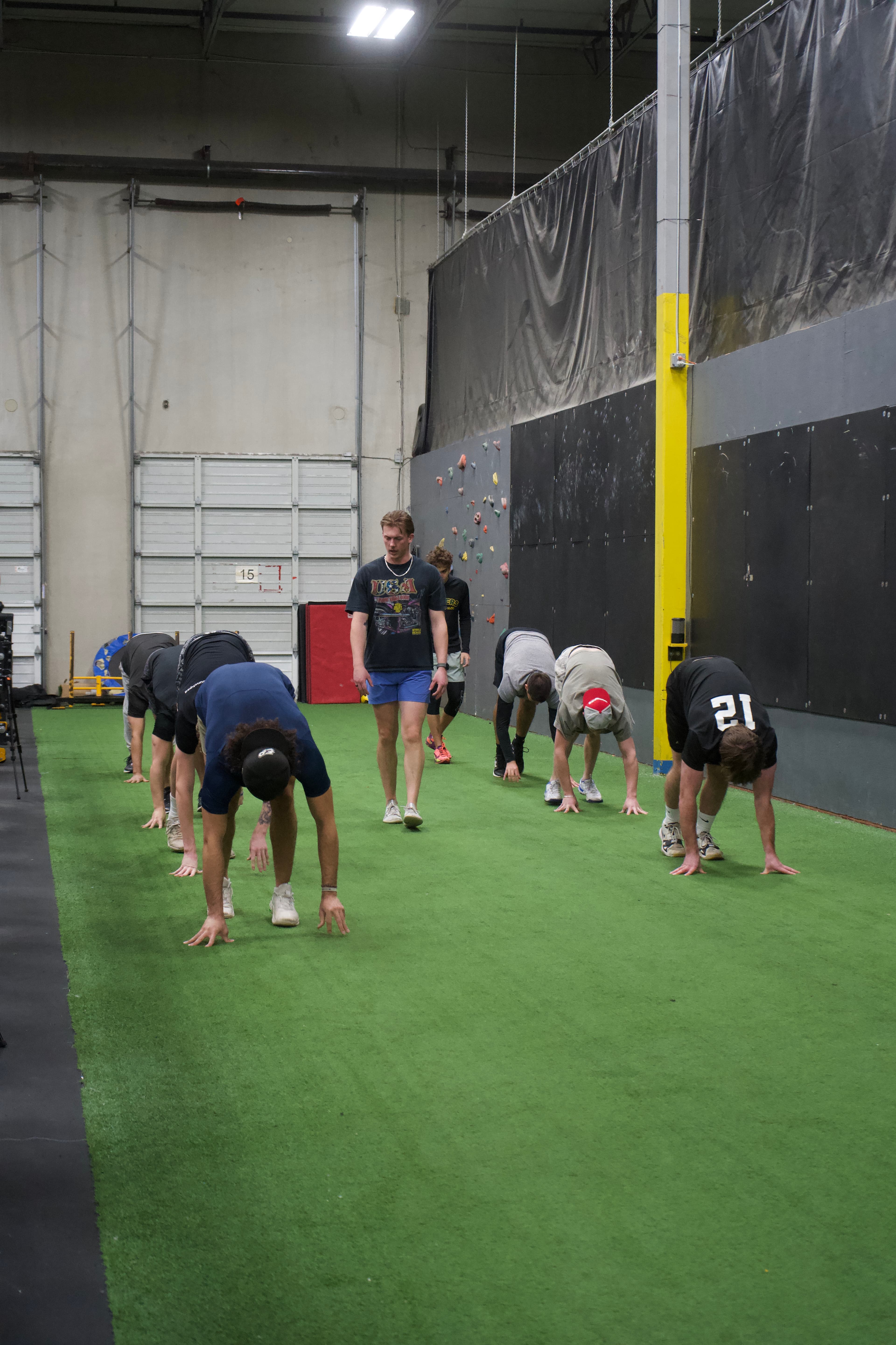 Athletes training on turf at a Driveline Baseball facility